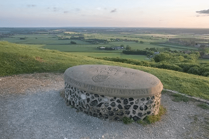 Stone viewpoint indicator overlooking the North Downs countryside near Wye