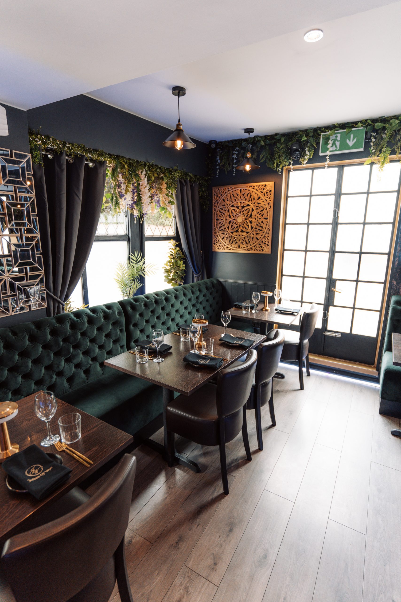 Joshan of Wye Indian restaurant dining area with green booth seating, Ashford