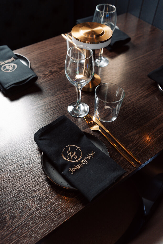 Elegant table setting with wine glasses at Joshan of Wye, Ashford