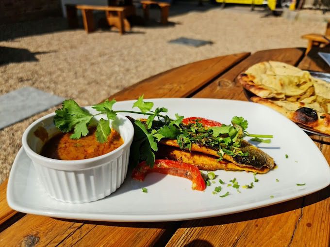 Grilled dish with curry and naan served at Joshan of Wye, Ashford