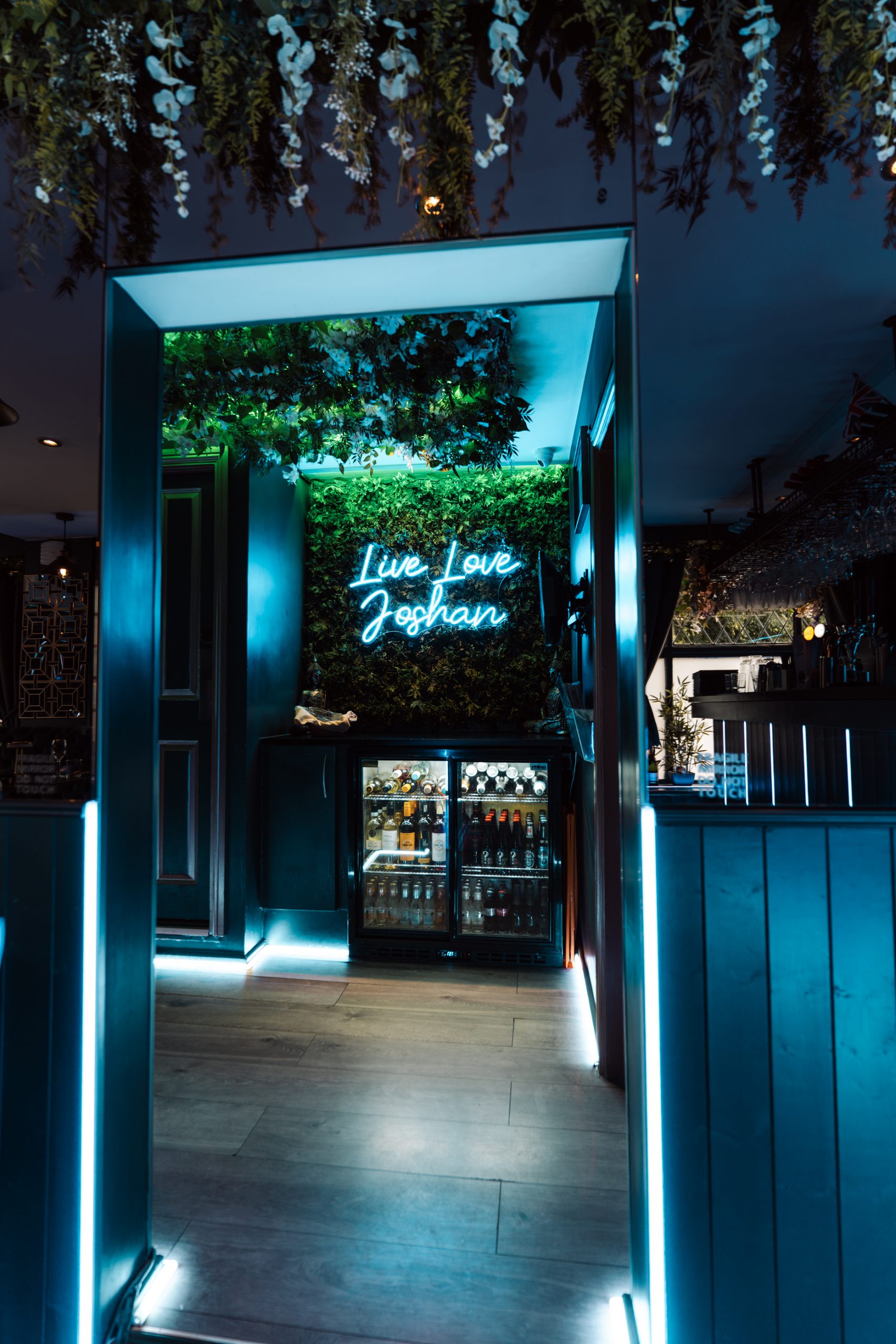 Joshan of Wye Indian restaurant illuminated entrance doorway, Ashford